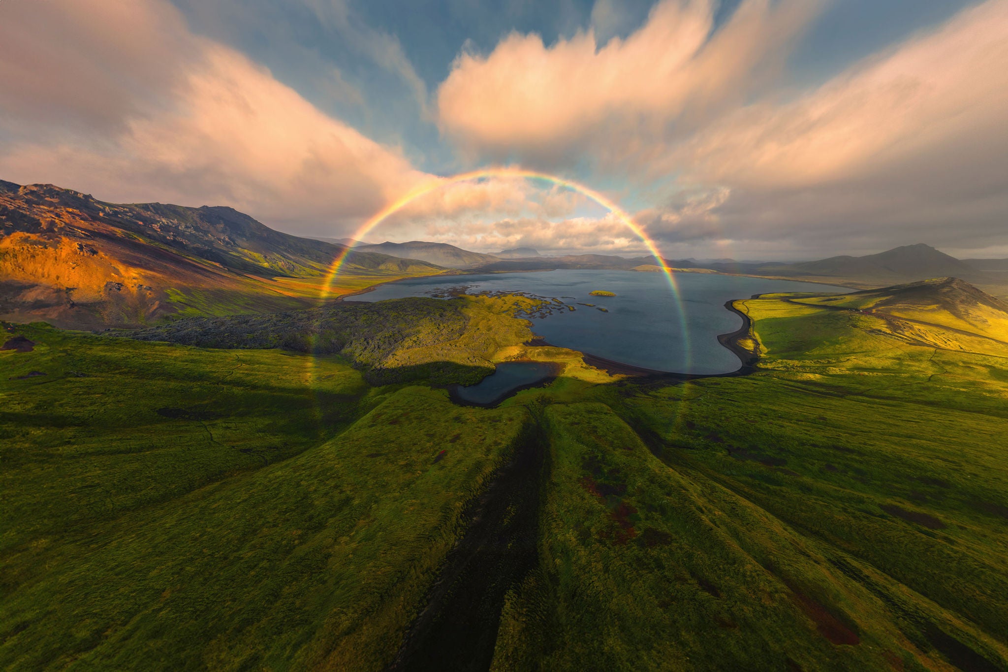 Aerial view of Frostastaoavatn lake with a vibrant rainbow