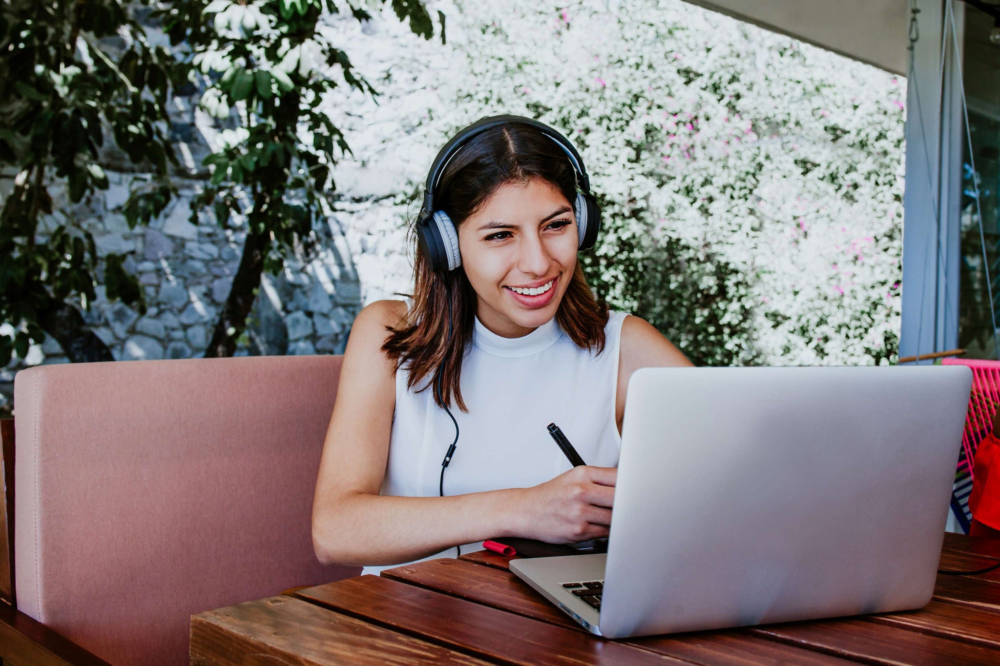 Young woman in her home office using laptop